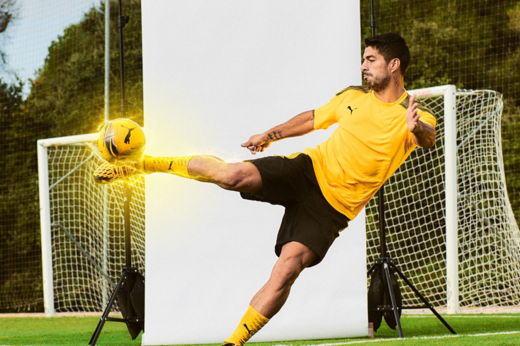 Puma soccer player kicking ball custom soccer jerseys custom sports uniforms