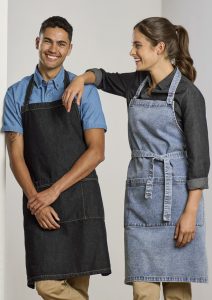man and woman modelling biz collection's clout apron in black and light denim