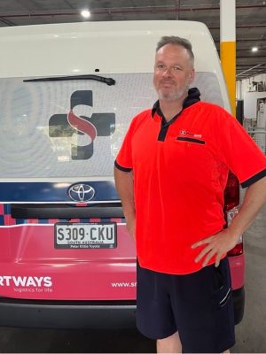 Smartways red hi-vis near van